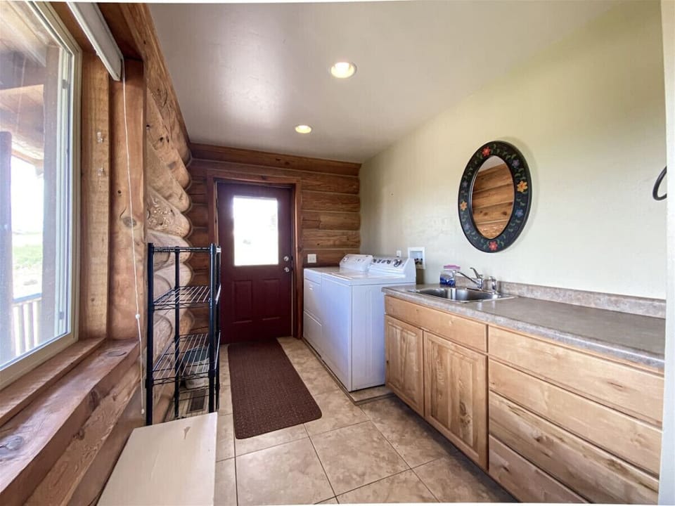 Bright and functional laundry space with rustic charm and convenient access to the outdoors