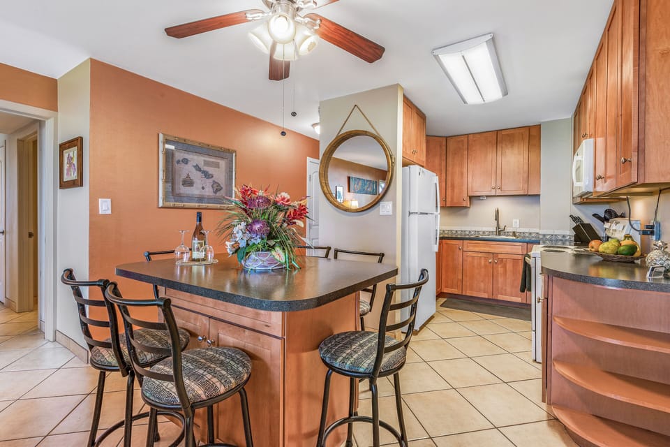 Dining area looking into full kitchen