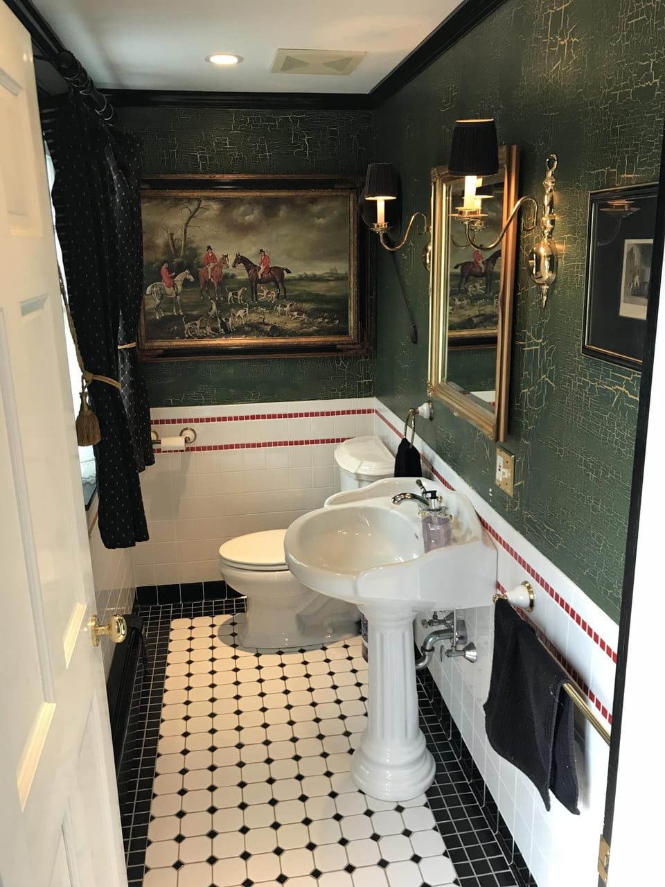 First floor half bath off the hallway. 