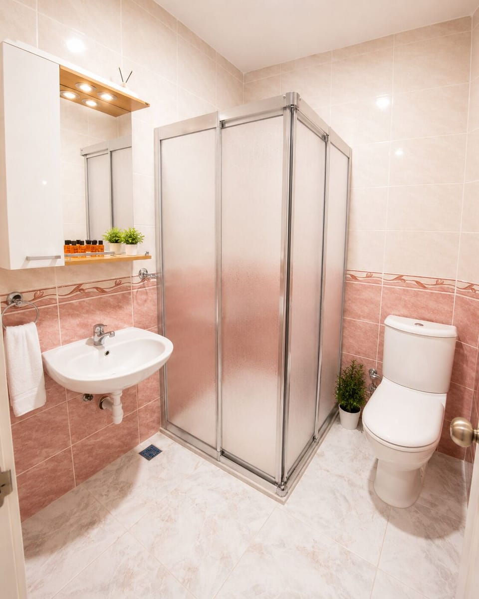 Shower, rainfall showerhead, free toiletries, hair dryer