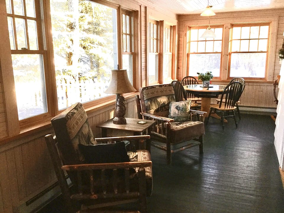 Porch seating are and table - our favorite spot for quiet breakfast