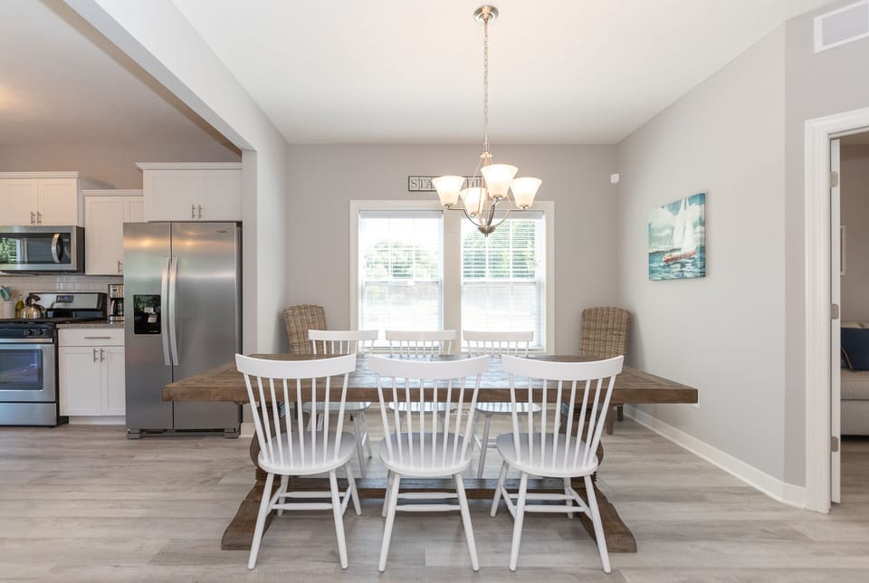 Dining table with chairs for 8.  Two additional chairs upstairs if needed. 