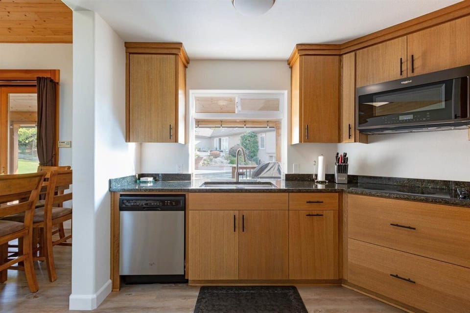 Dishwasher, sink, convection microwave/oven, stove.