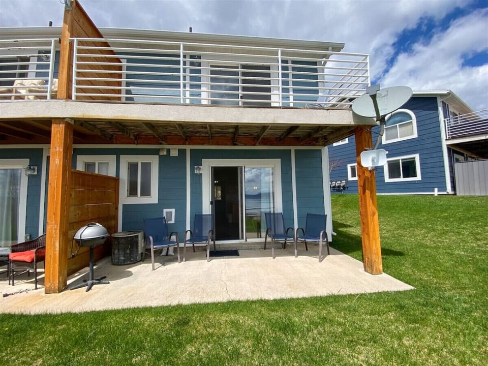 Enjoy outdoor lounging on the covered patio with grill