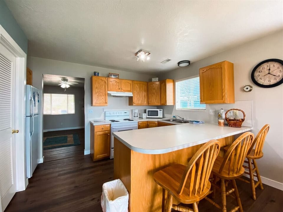 Bright kitchen with generous counter space and seating for guests