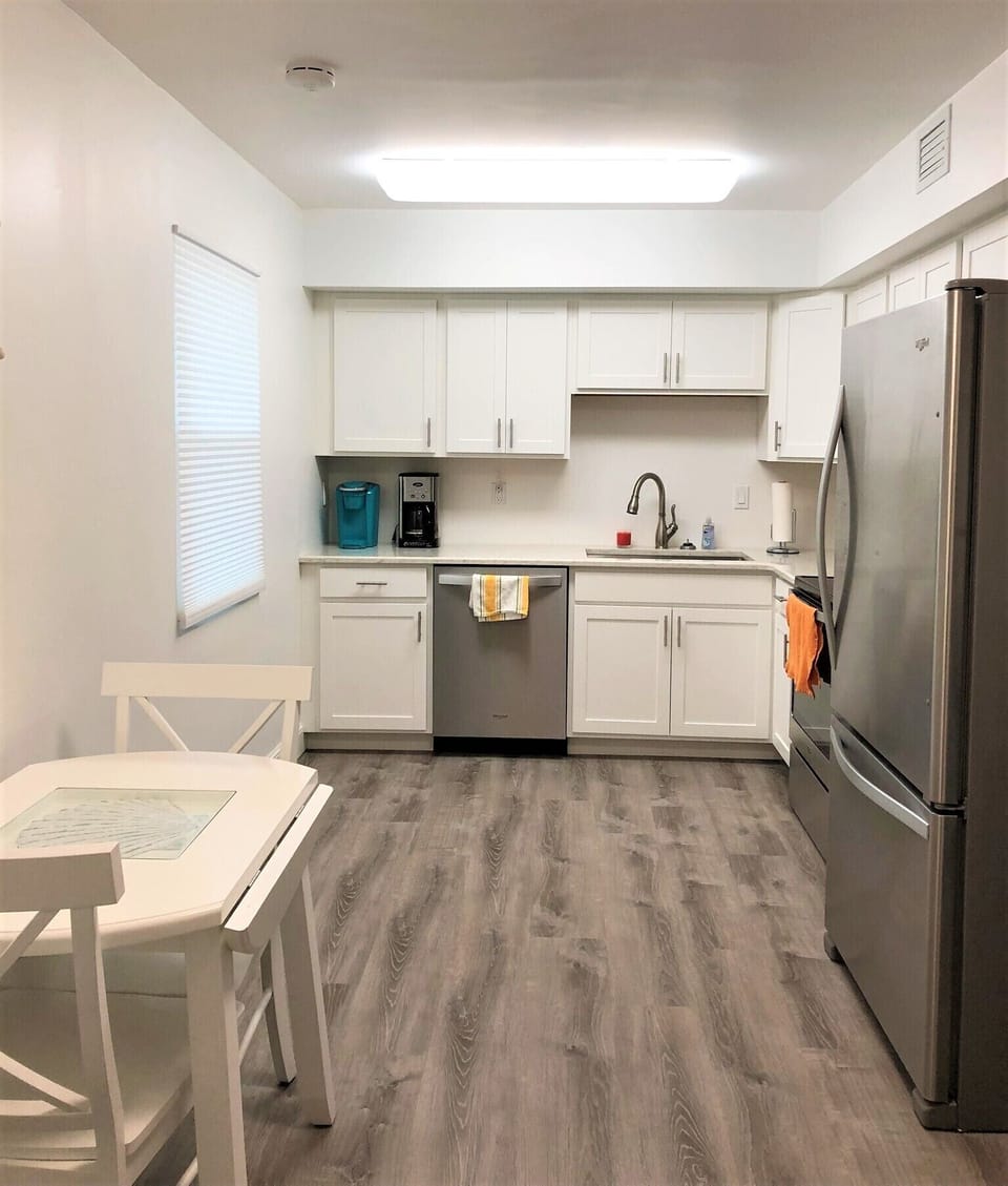Kitchen features new appliances and is fully furnished dishes, pots, etc.