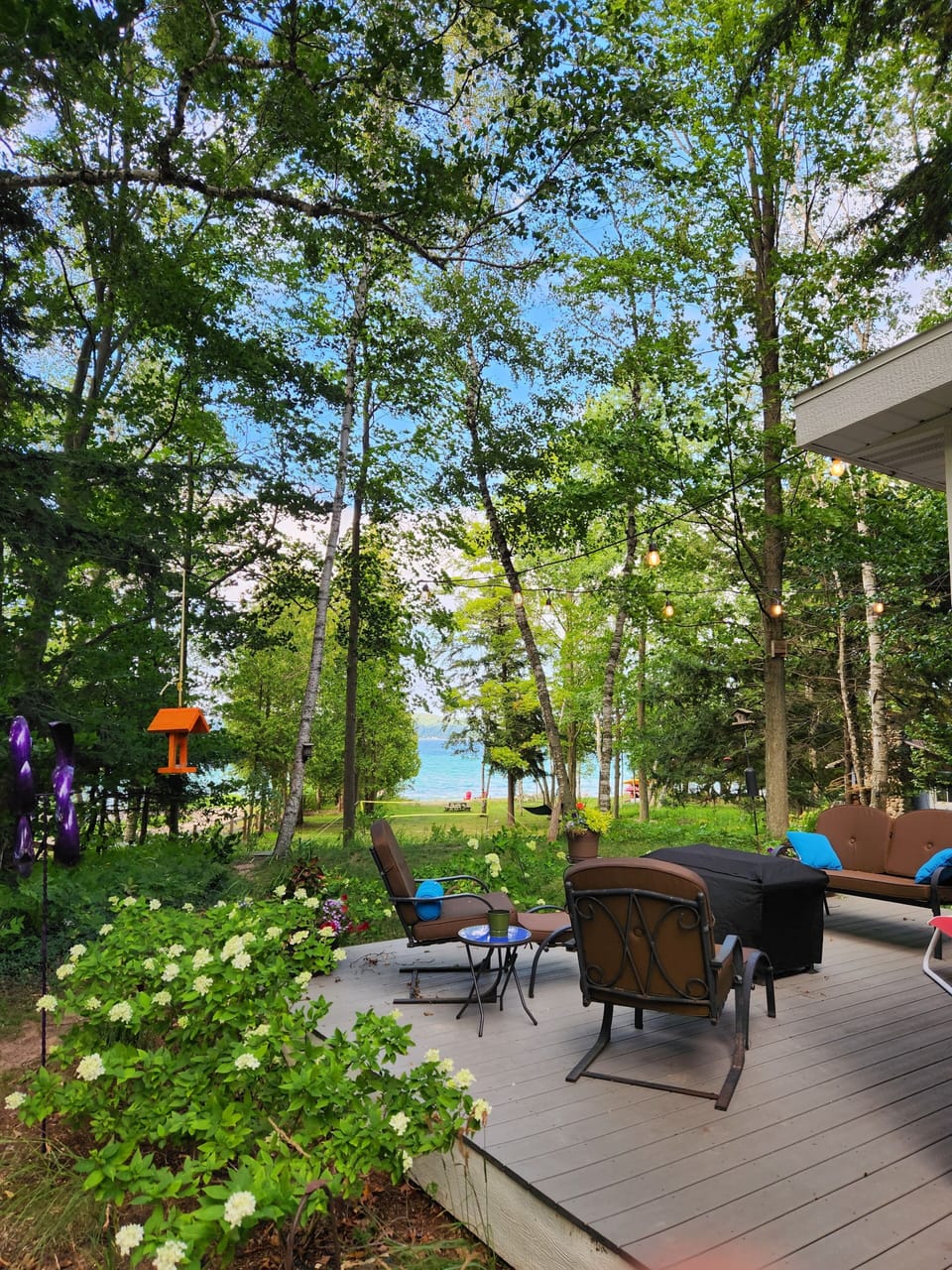 Enjoy your morning coffee on the deck overlooking the front yard and beach