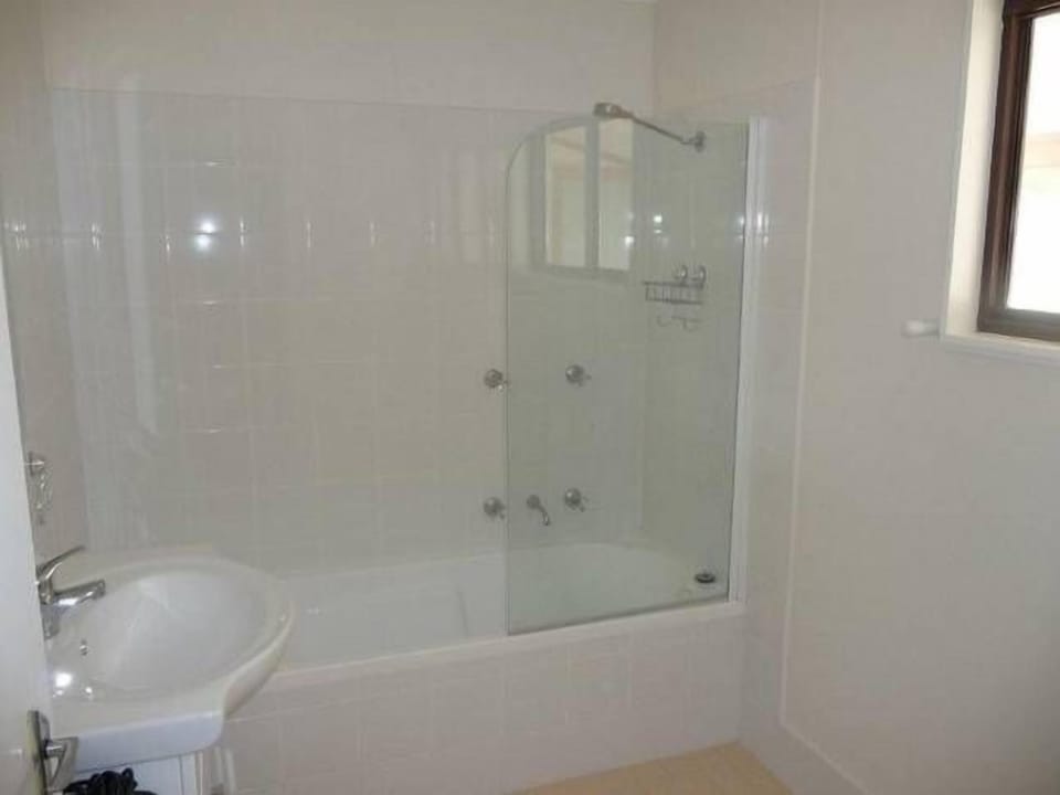 Property has three bathrooms including three (plus outdoor) showers & a bathtub