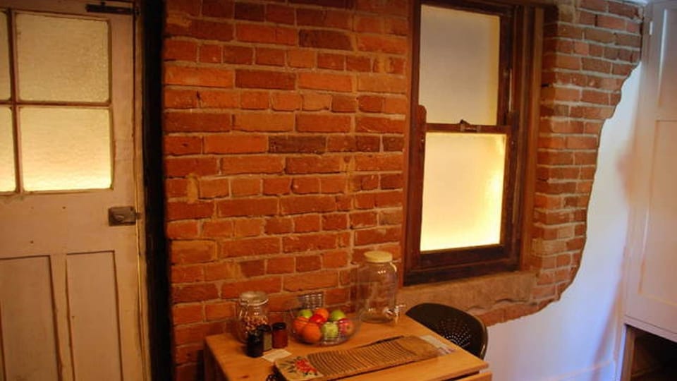 Backlit to show where the original door and window is.  Inaccessible to outside.