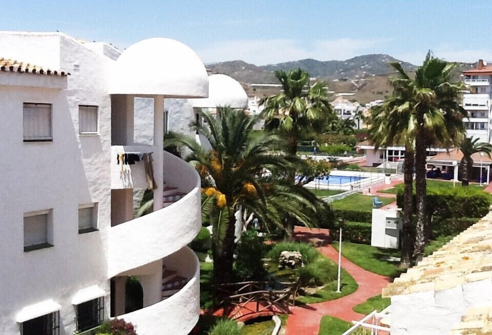 View from apartment of pools and cafe, mountain views