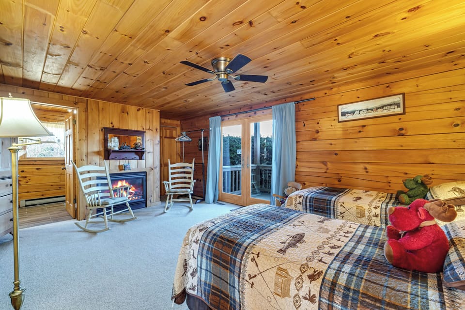 one of the bedrooms. 3 Twin beds and fireplace, full bathroom. ADA-friendly