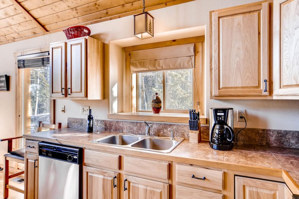 The views from the kitchen are beautiful and it is open to the living area and the dining room so that the chef of the group can talk while cooking.