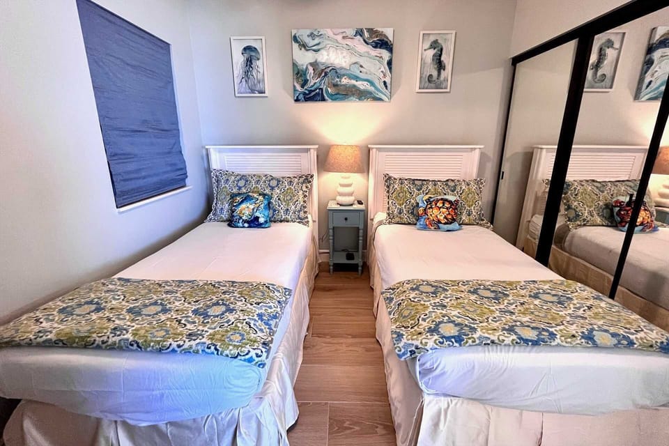 The second bedroom includes two Twin-sized beds and private bathroom.