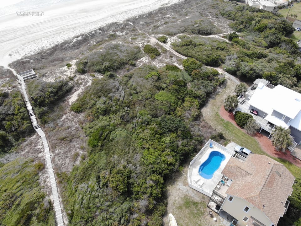 another aerial shot of home with pool
