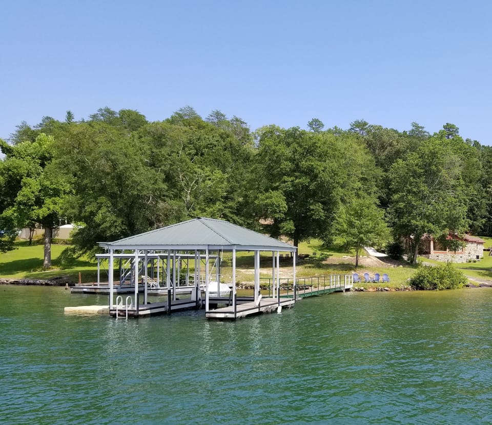Dock and great swim beach area.  Sandy bottom  area. Picnic area also lakeside.