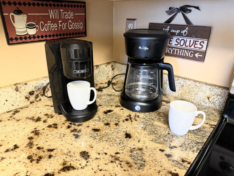 Both styles of coffee maker present in the unit. Have the coffee you like.