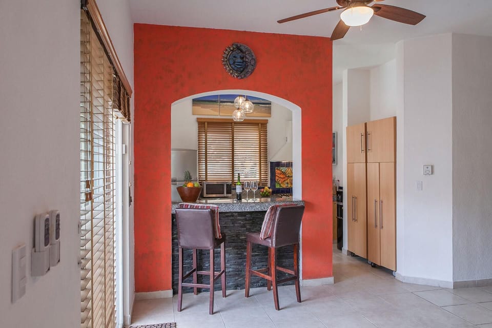 The kitchen bar and door to the terrace