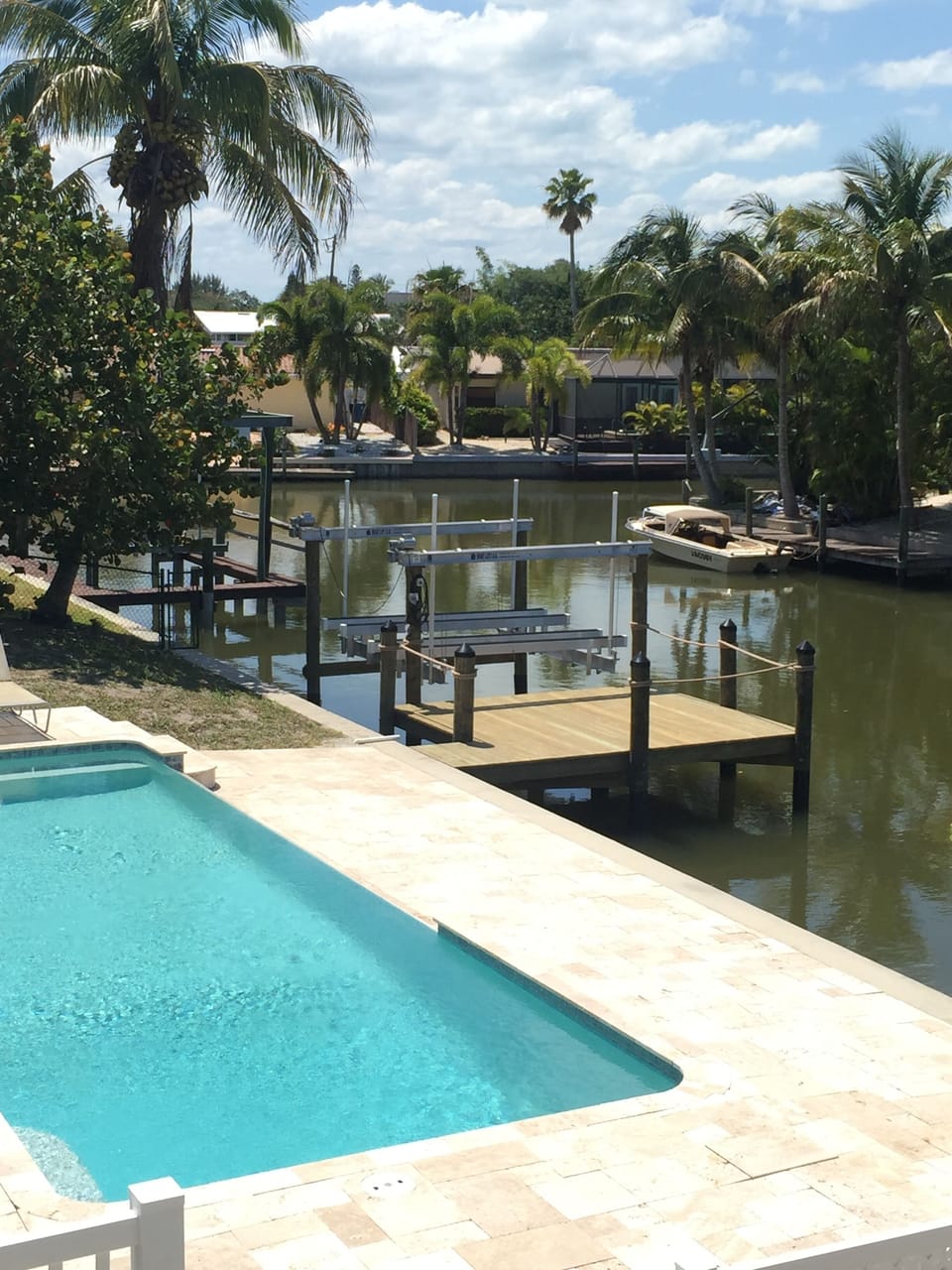 Aerial view of pool, lower deck, dock and corner of canal
