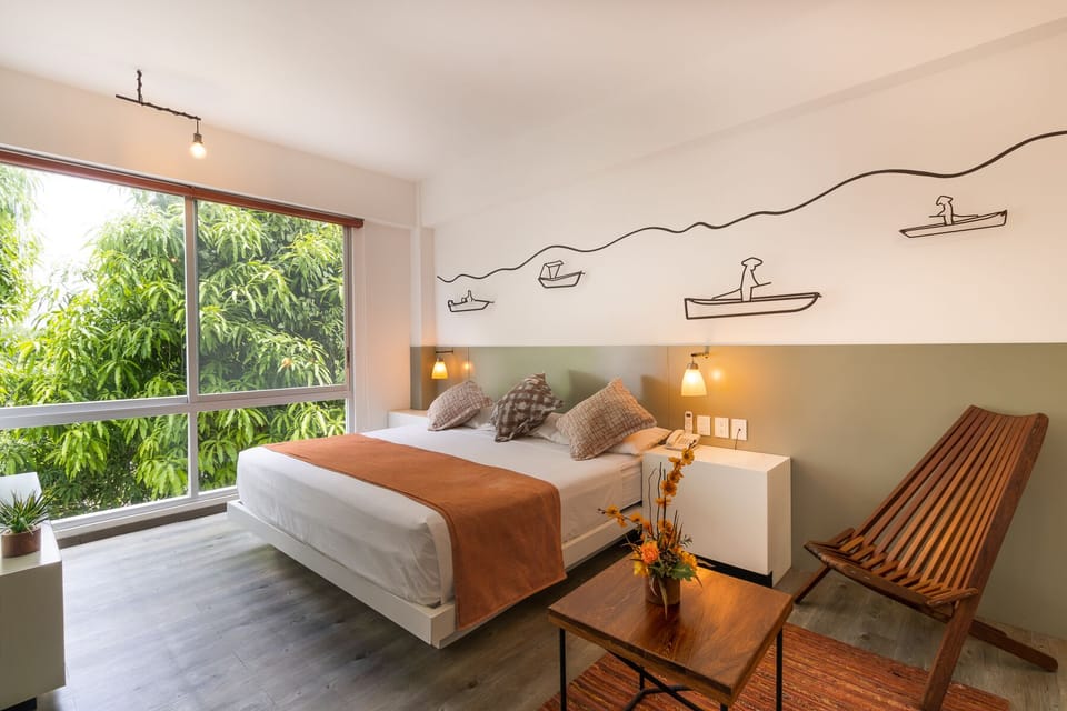 Deluxe Room, 1 King Bed, Non Smoking, Mountain View | In-room safe, blackout drapes, iron/ironing board
