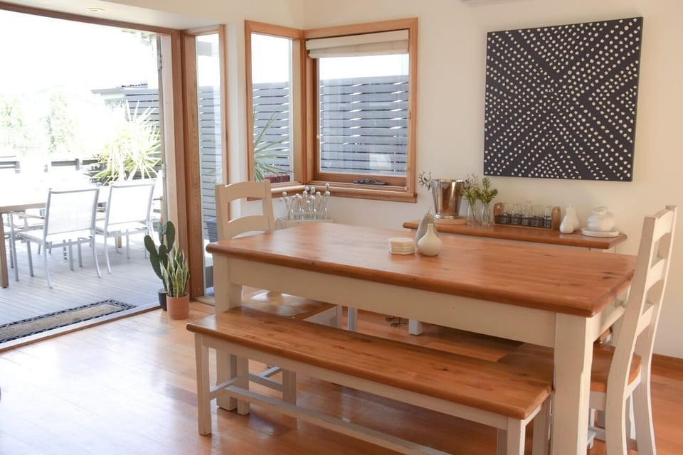 Indoor / Outdoor dining flow seamlessly with double French doors