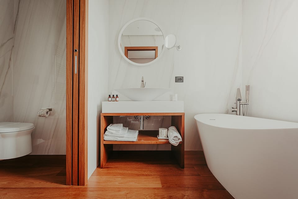 Junior Suite | Bathroom | Shower, hydromassage showerhead, hair dryer, slippers