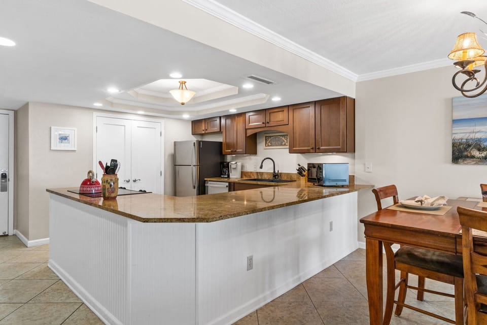 Large open fully stocked kitchen with granite countertops