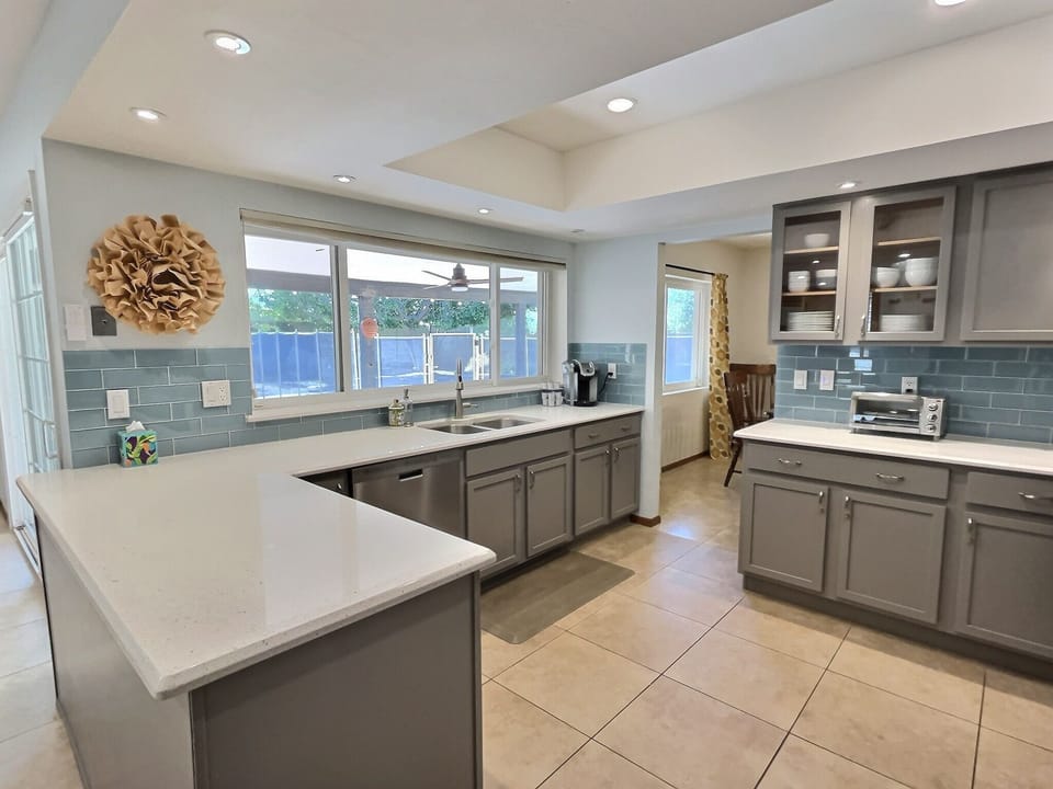 Kitchen overlooking the pool and yard