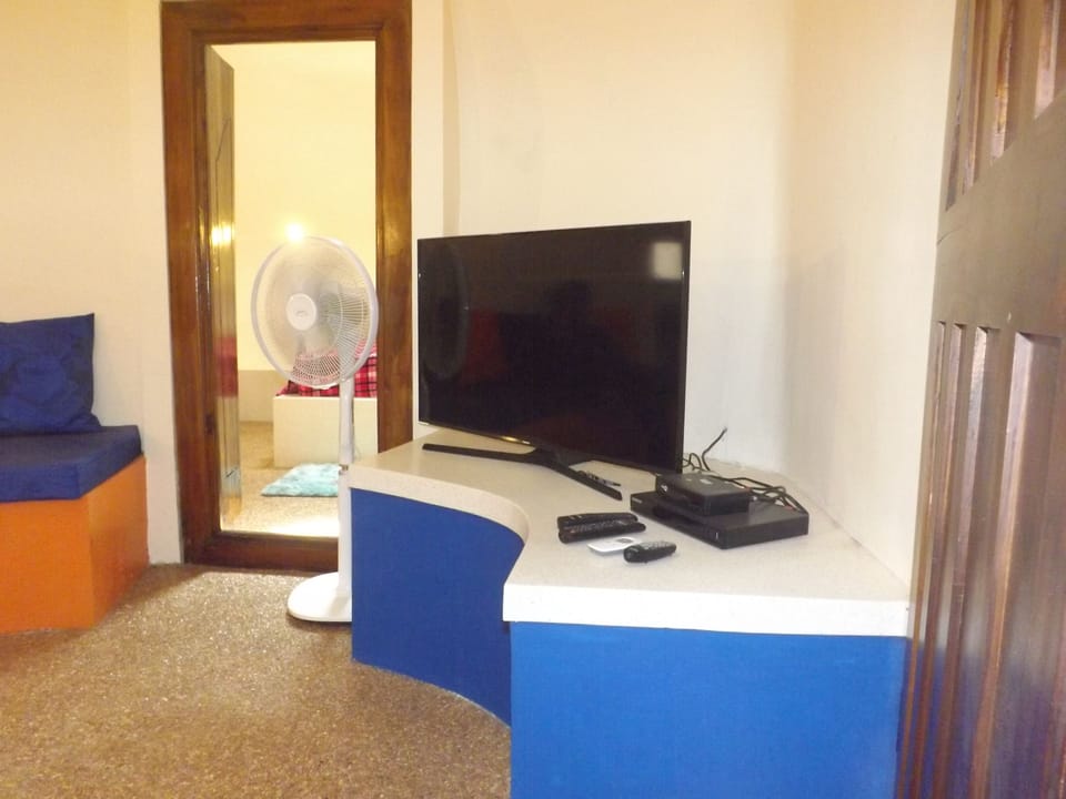 Deluxe Villa, 2 Bedrooms | Living room | 60-inch LED TV with digital channels, TV
