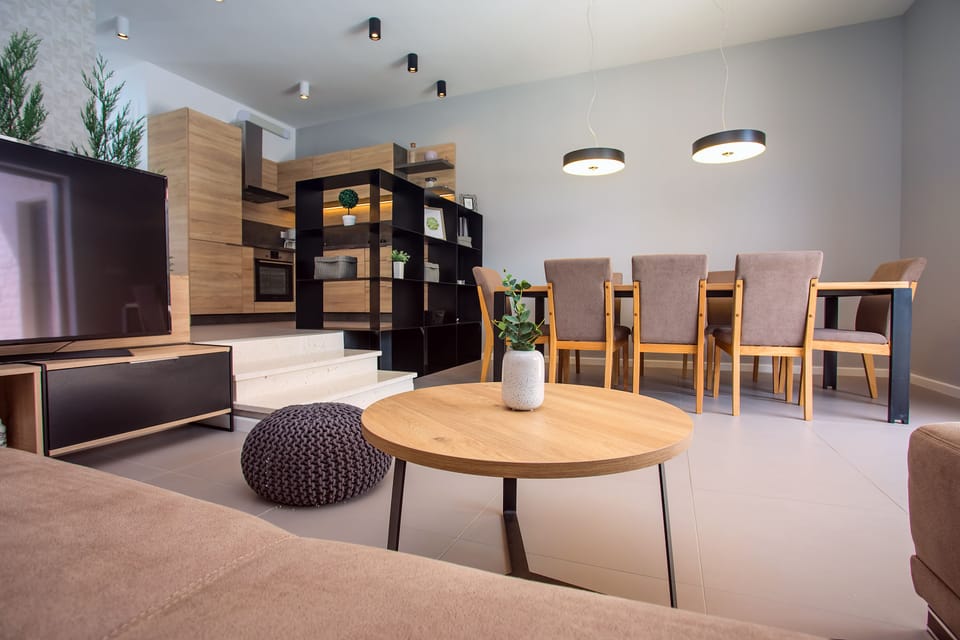 Modern dining and living area in front of the beautiful outdoor area
