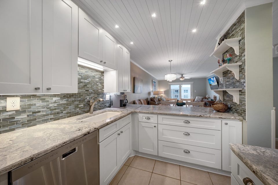 Enjoy the convenience of the fully-equipped kitchen, offering everything you need for your stay in New Smyrna Beach