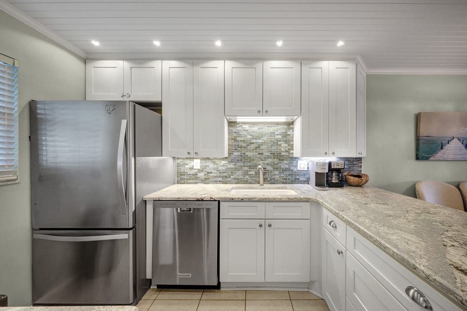 This beautifully updated kitchen at Sea Coast Gardens II 508 offers stainless steel appliances and everything you need for a seamless vacation