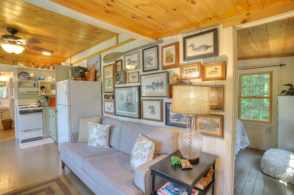 Seating Area includes a Sofa and Chair with views of the Lake