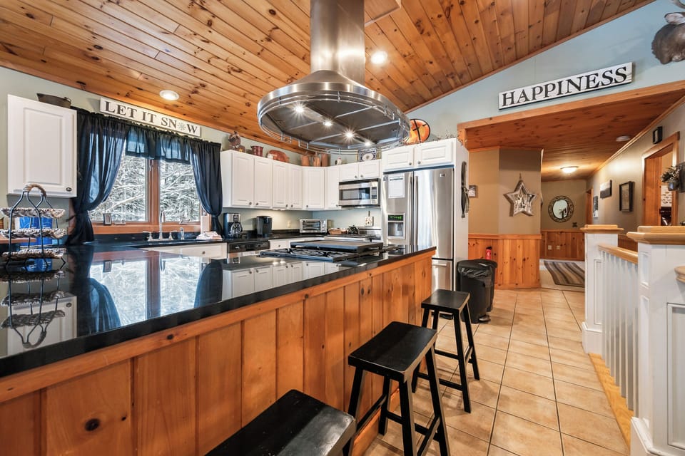 View into kitchen with island seating