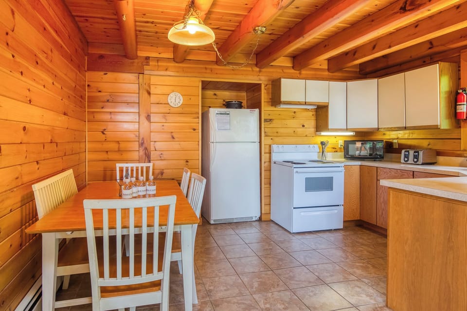 Dining area with views of kitchen