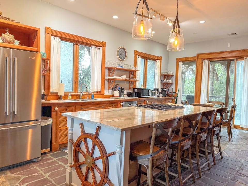 Fully stocked kitchen with large island.
