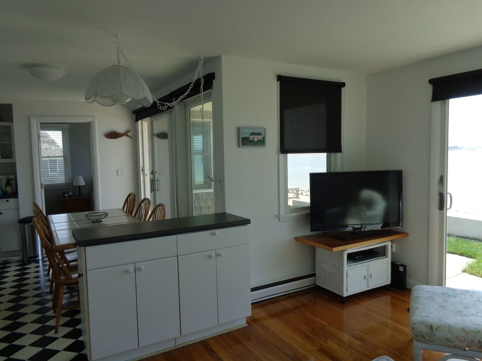 Living room looking to kitchen and primary bedroom