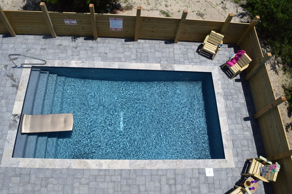 A view from the top deck, beautiful new cement pool. 
