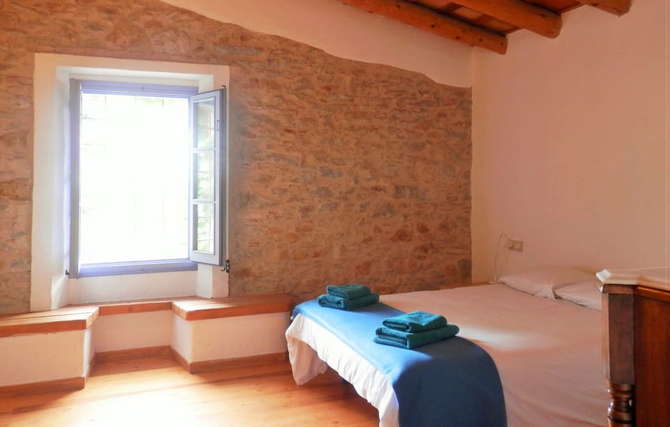 ‘Oliveres’ Room views to the garden, the pool area and the Olive tree plantation