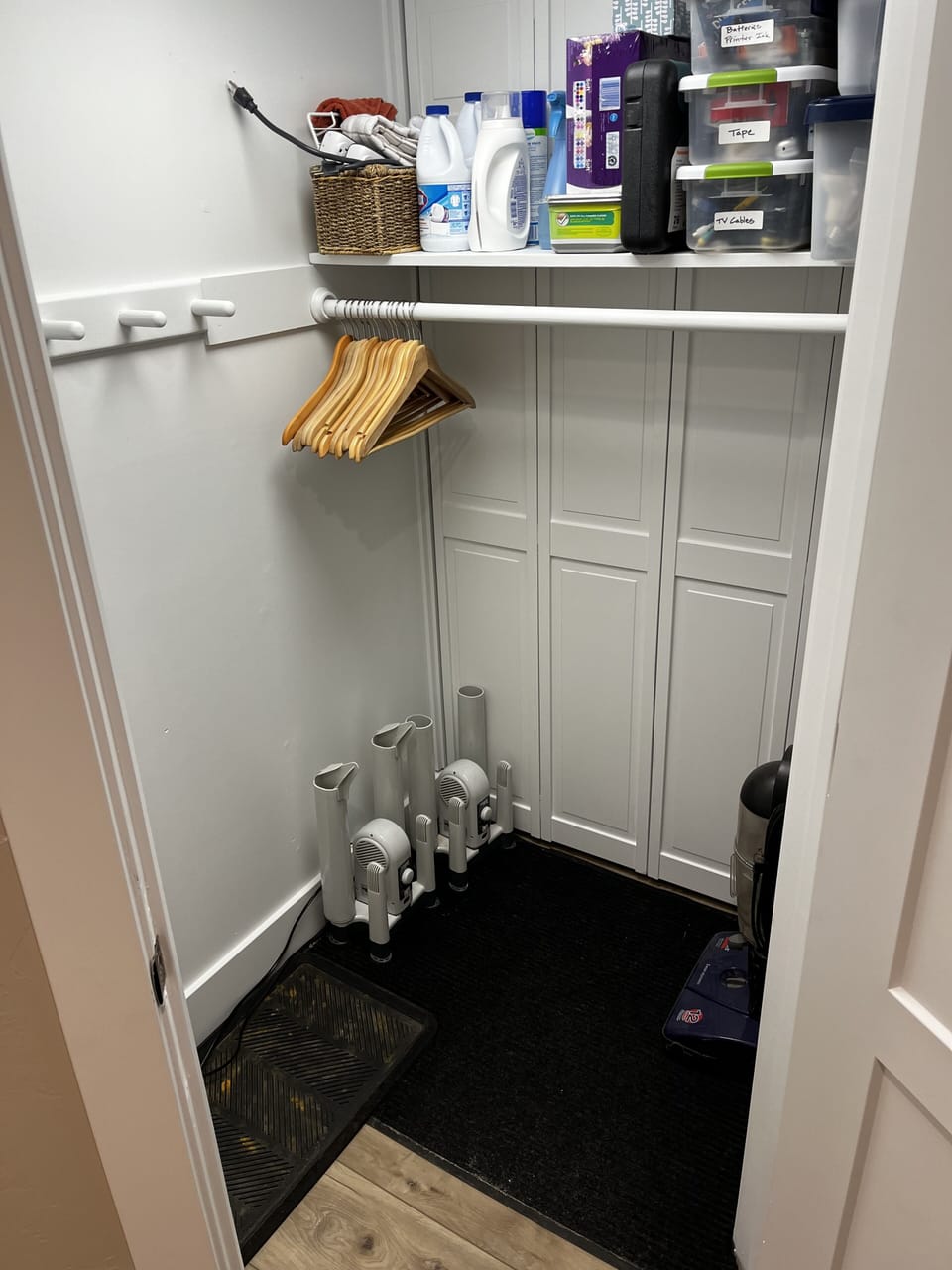 Large closet for ski equipment and coats and a pair of boot and glove dryers