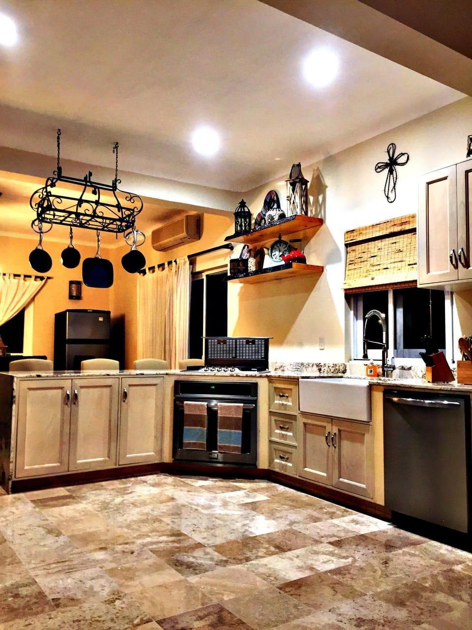 automated downdraft stove vent can be seen in this photo. Granite countertops