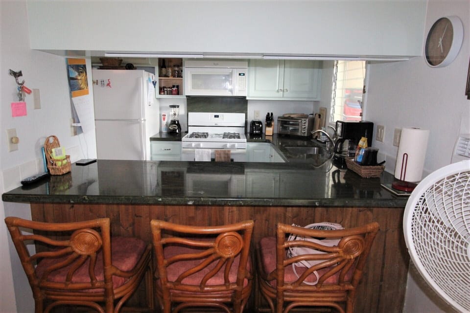 Direct View of Kitchen from Living Room/Bar Area