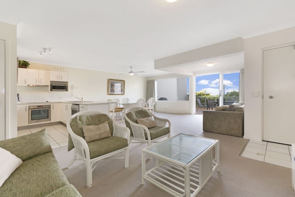 Standard Apartment, 1 Queen Bed, Ocean View, Beachside | Living area | 50-inch TV with cable channels, DVD player