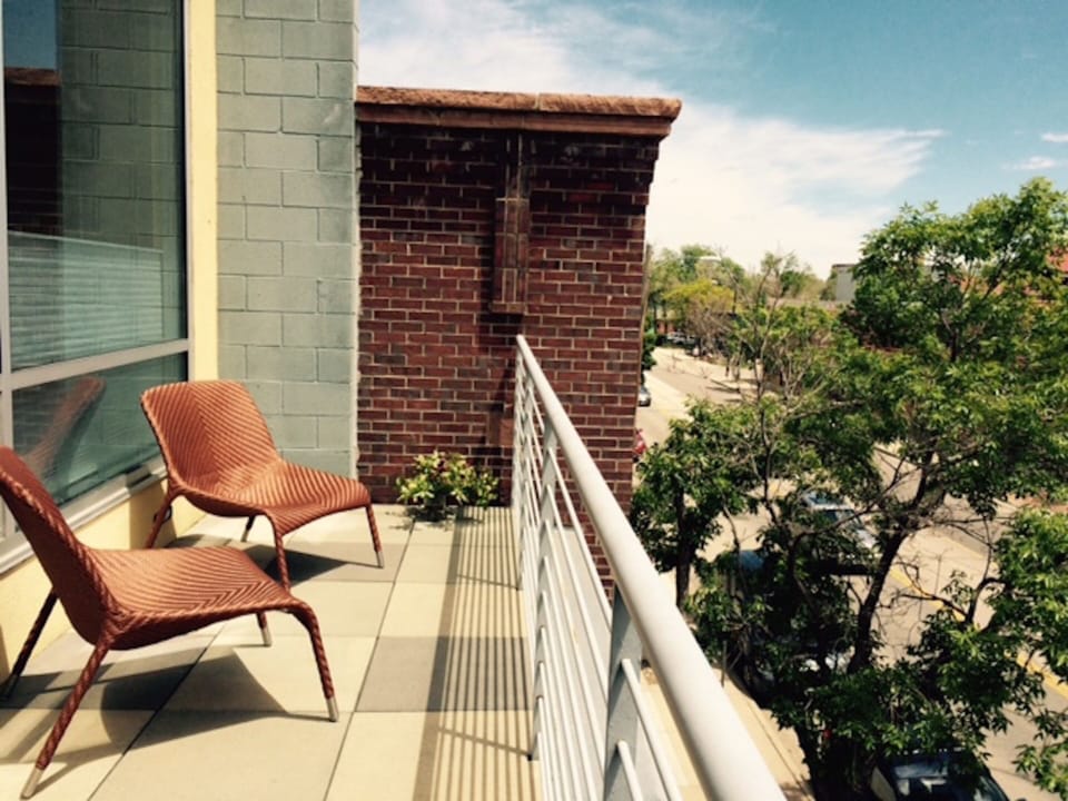 Sunny South facing deck overlooks Pearl Street.