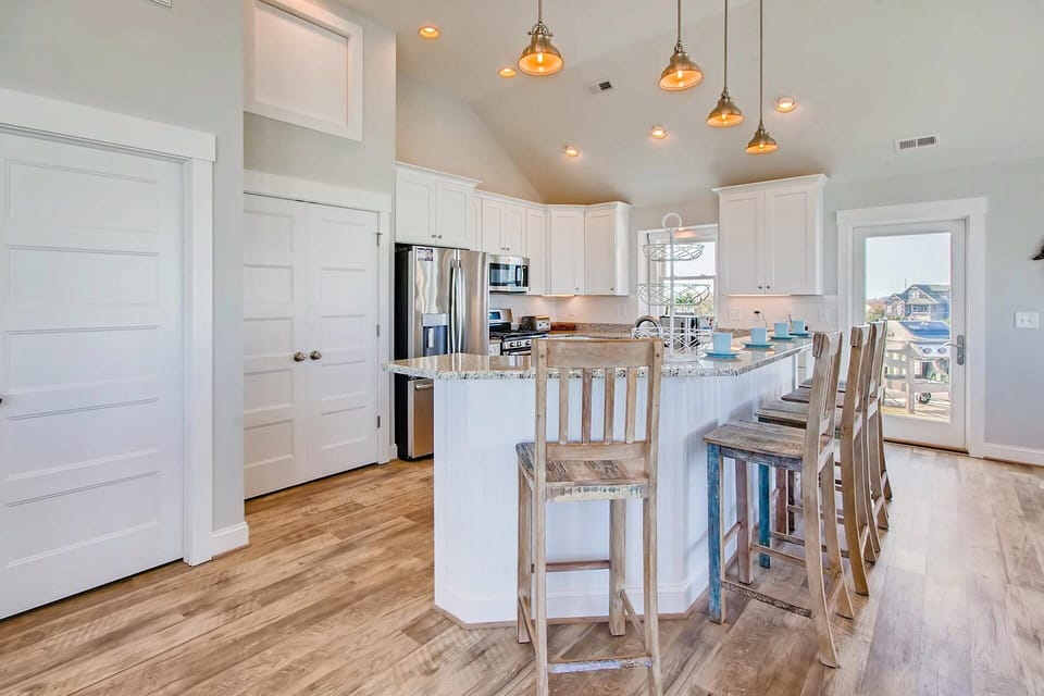 Pull up a stool to the 5-person breakfast counter to watch the chef work their magic in the kitchen.