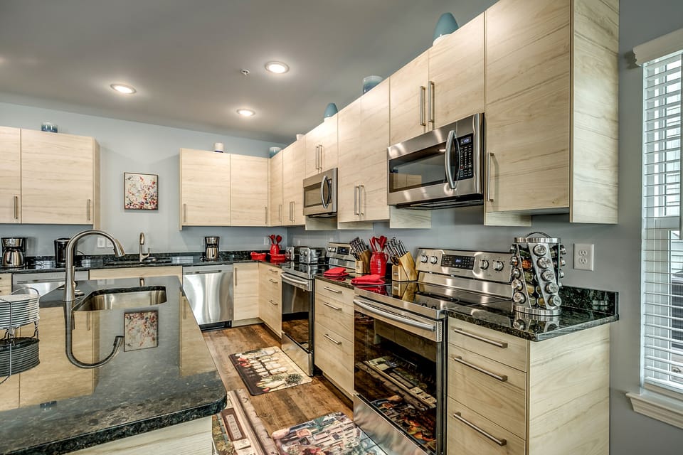 2 ovens, 2 microwaves, 2 large kitchen sinks, 3 dishwashers 