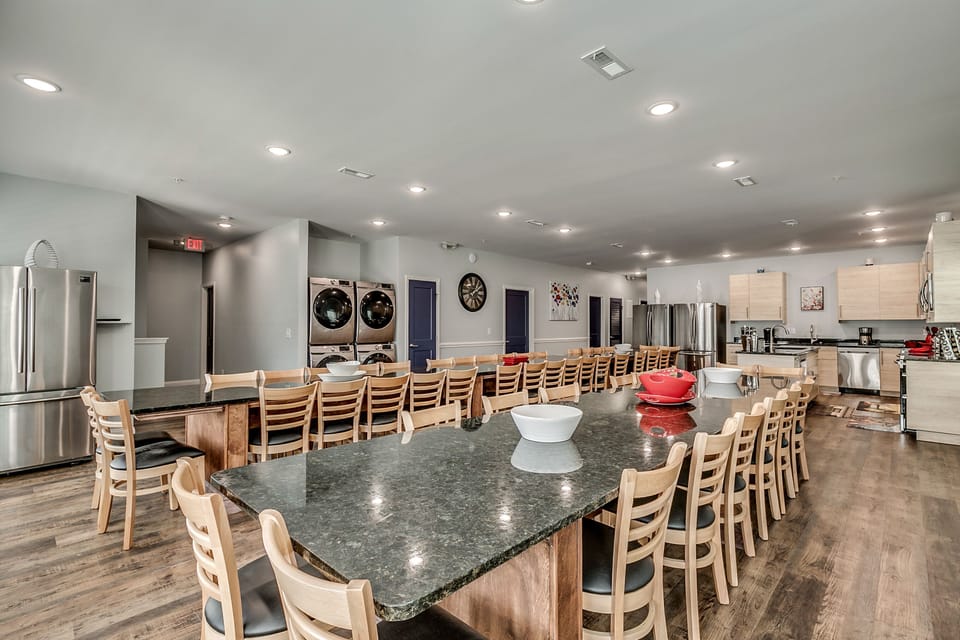 Extended Kitchen and dining room with 2 tables and  laundry area #1