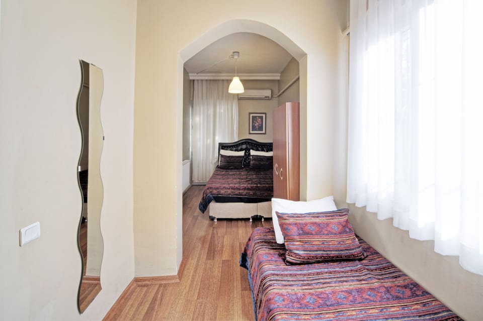 Triple Room, Private Bathroom | Iron/ironing board, free WiFi, bed sheets