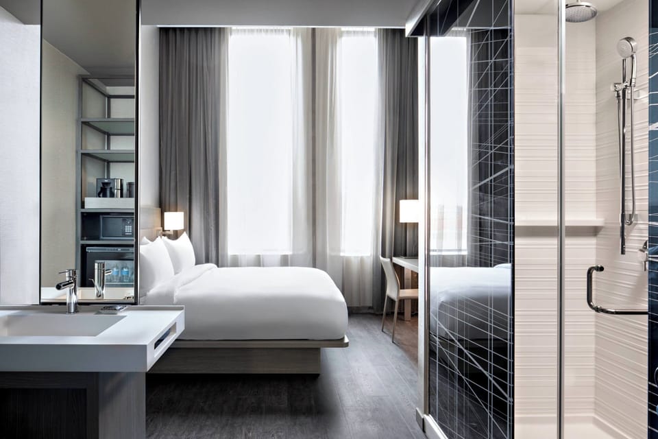 Rainfall showerhead, free toiletries, hair dryer, towels