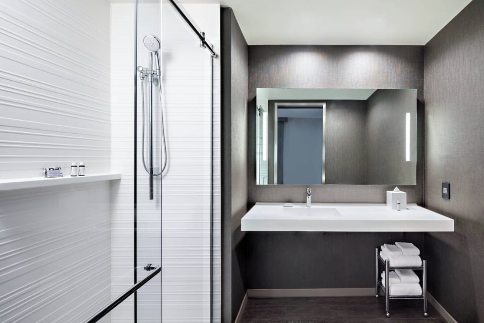 Rainfall showerhead, free toiletries, hair dryer, towels