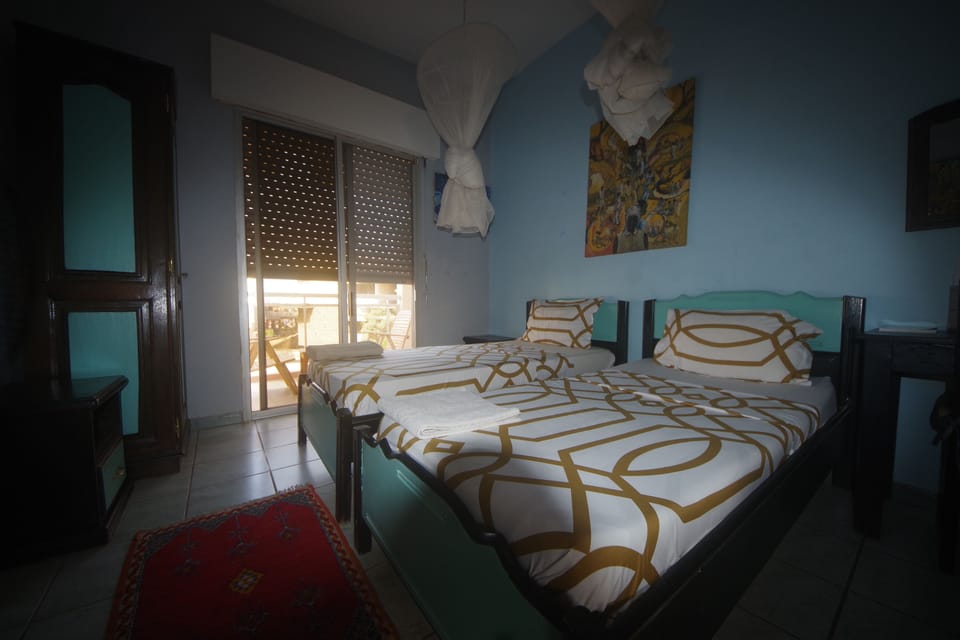Twin Room, Shared Bathroom | Laptop workspace, blackout drapes, iron/ironing board (on request)